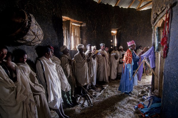 Ethiopia, Religion, Christianity, Service inside rural mud built rural Christian church. 
Photo : Adrian Arbib