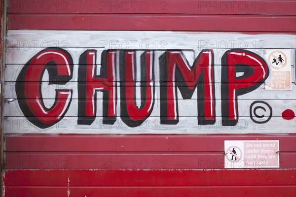 Art, Graffiti, Former parcel delivery warehouse converted into roller disco with the walls decorated by local graffiti artists. Chump written in red paint. 
Photo : Stephen Rafferty