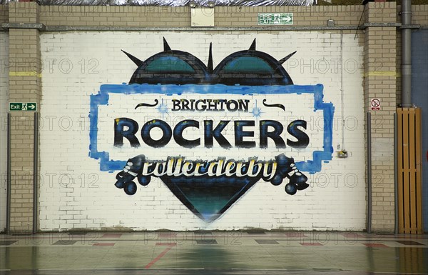 Art, Graffiti, Former parcel delivery warehouse converted into roller disco with the walls decorated by local graffiti artists. Painted logo for Brighton Rockers Rollerderby. 
Photo : Stephen Rafferty