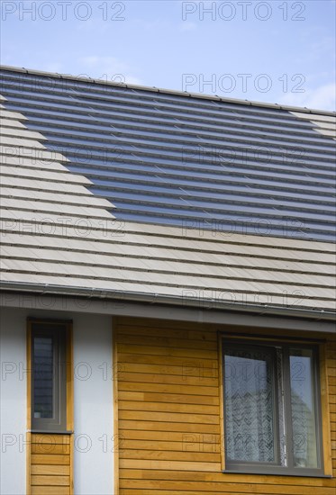 Architecture, Environment, Solar Power, Alternative Energy Electricity Solar photovoltaic roof tiles or slates on new houses by Linden Homes in Graylingwell Park. 
Photo : Paul Seheult
