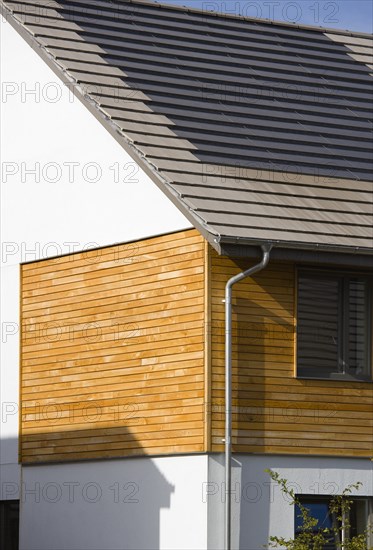 Architecture, Environment, Solar Power, Alternative Energy Electricity Solar photovoltaic roof tiles or slates on new houses by Linden Homes in Graylingwell Park. 
Photo : Paul Seheult