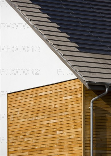 Architecture, Environment, Solar Power, Alternative Energy Electricity Solar photovoltaic roof tiles or slates on new houses by Linden Homes in Graylingwell Park. 
Photo : Paul Seheult