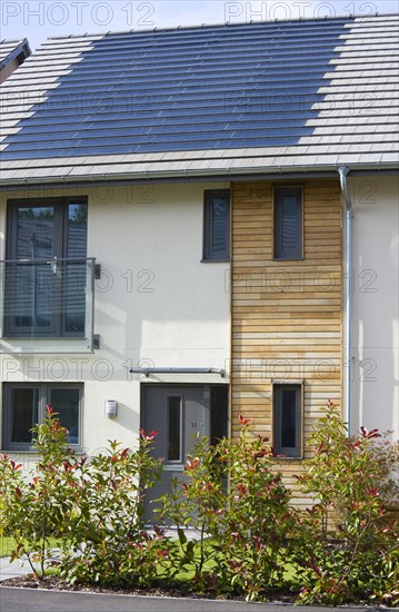 Architecture, Environment, Solar Power, Alternative Energy Electricity Solar photovoltaic roof tiles or slates on new houses by Linden Homes in Graylingwell Park. 
Photo : Paul Seheult