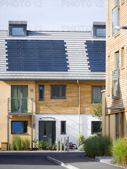 Architecture, Environment, Solar Power, Alternative Energy Electricity Solar photovoltaic roof tiles or slates on new houses by Linden Homes in Graylingwell Park. 
Photo : Paul Seheult