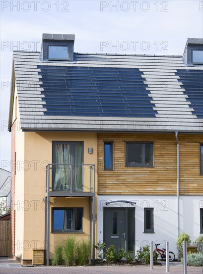 Architecture, Environment, Solar Power, Alternative Energy Electricity Solar photovoltaic roof tiles or slates on new houses by Linden Homes in Graylingwell Park. 
Photo : Paul Seheult