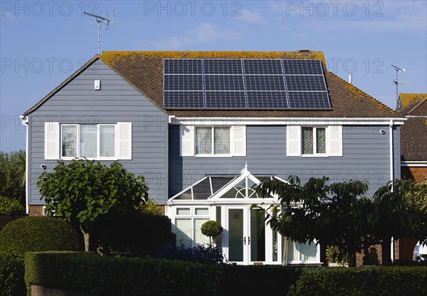 Architecture, Environment, Solar Panels, Alternative Energy Electricity Solar photovoltaic roof panels on detached house for electricity conversion. 
Photo : Paul Seheult