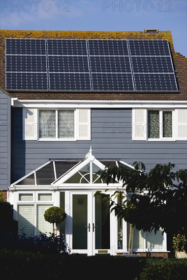 Architecture, Environment, Solar Panels, Alternative Energy Electricity Solar photovoltaic roof panels on detached house for electricity conversion. 
Photo : Paul Seheult