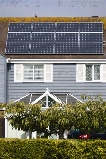 Architecture, Environment, Solar Panels, Alternative Energy Electricity Solar photovoltaic roof panels on detached house for electricity conversion. 
Photo : Paul Seheult