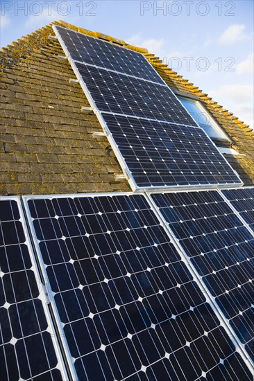 Architecture, Environment, Solar Panels, Alternative Energy Electricity Solar photovoltaic roof panels on detached house for electricity conversion. 
Photo : Paul Seheult