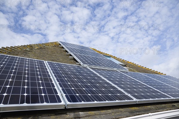 Architecture, Environment, Solar Panels, Alternative Energy Electricity Solar photovoltaic roof panels on detached house for electricity conversion. 
Photo : Paul Seheult