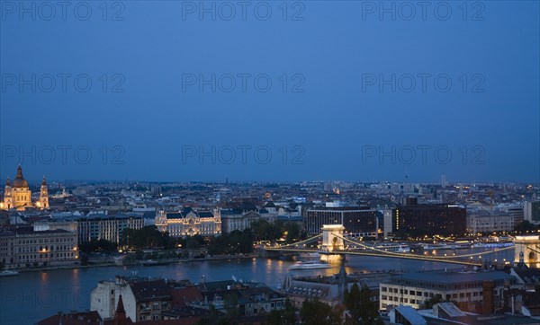 Buda Castle District view over Danube and Pest with St Stephen's Basilica illuminated.