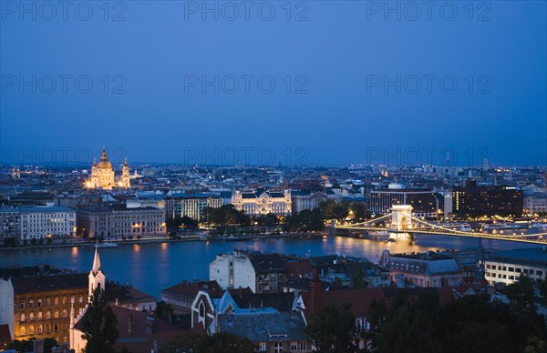 Buda Castle District: view over Danube and Pest with St Stephen's Basilica illuminated.