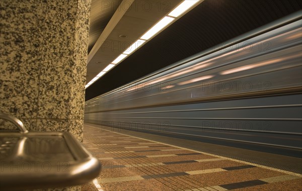 Underground train arriving at platform on Metro system.