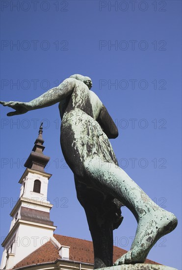 Buda Castle District: bronze statue in clear blue sky.