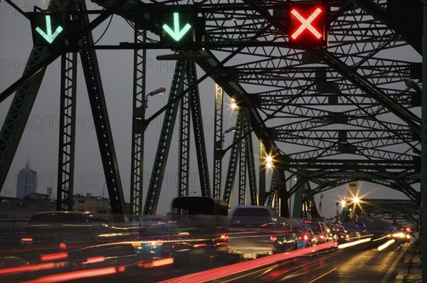 Traffic flow control in evening rush hour on Saphan Phut Memorial Bridge.