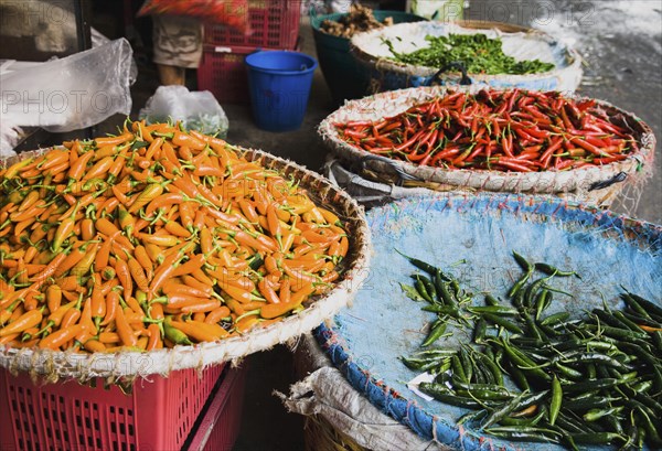 Red green and yellow chilis in Chinatown market.