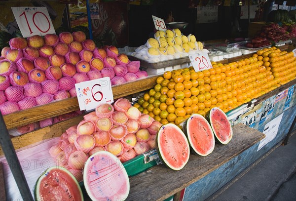 Fresh fruit stall in shade.