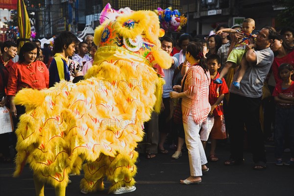 Yellow Dragon in dance troupe performance for Chinese New Year show.