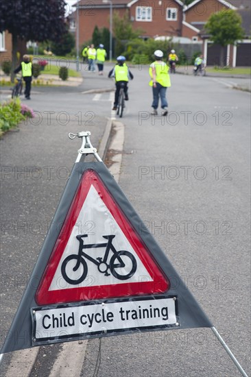 School children being taught cycle safety lessons on public roads.