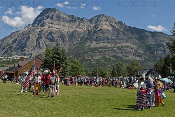Pow Wow Grand Entry at the Blackfoot Arts & Heritage Festival to celebrate Parks Canada's centennial Flags of Canada and the United States