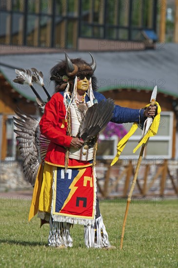 Blackfoot dancer in a buffalo headdress at the Blackfoot Arts & Heritage Festival Pow Wow organized by Parks Canada and the Blackfoot Canadian Cultural Society.