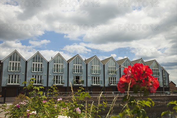 Waterside wooden cladded homes next to Canal Basin.