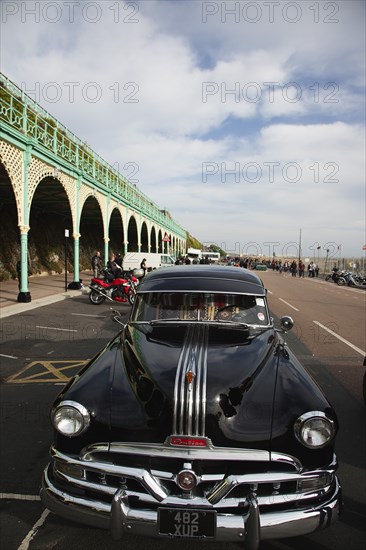 Old American Pontiac automobile on Madeira Drive during classic car festival.