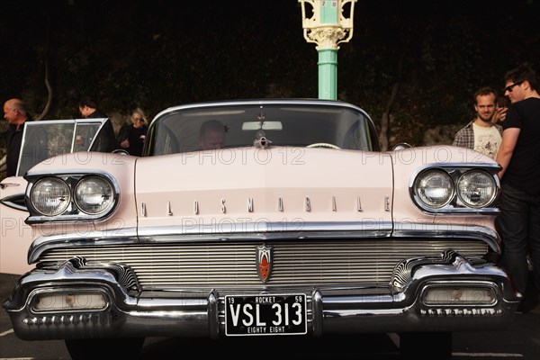 Old American Oldsmobile on Madeira Drive during classic car festival.