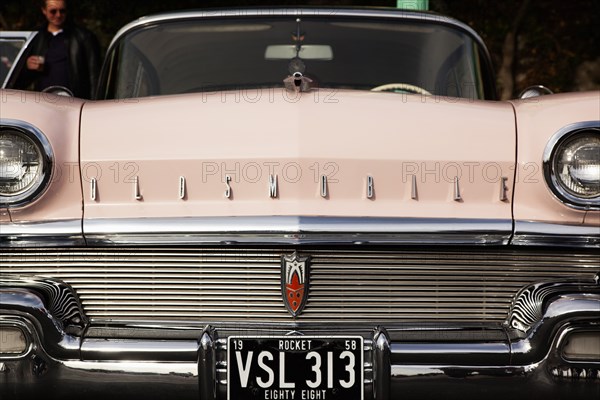 Old American Oldsmobile on Madeira Drive during classic car festival.