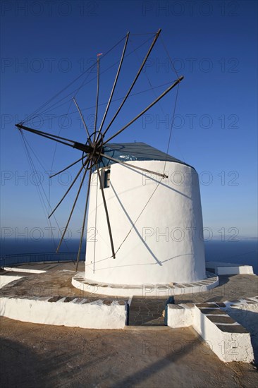 Old wind mill which is now converted to accomodation on the top of a cliff.