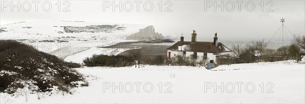 Seven Sisters Snow covered chalk cliffs viewed from the coastguard cottages at Cuckmere Haven.