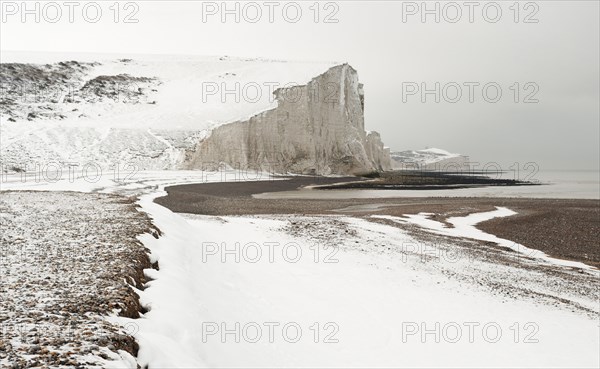 Seven Sisters Snow covered chalk cliffs viewed from the coastguard cottages at Cuckmere Haven.