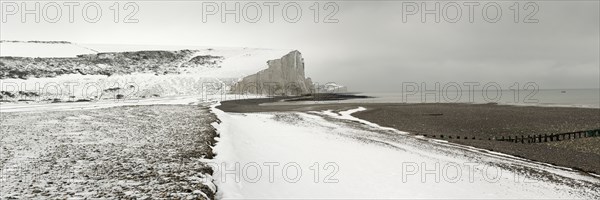 Seven Sisters Snow covered chalk cliffs viewed from the coastguard cottages at Cuckmere Haven.