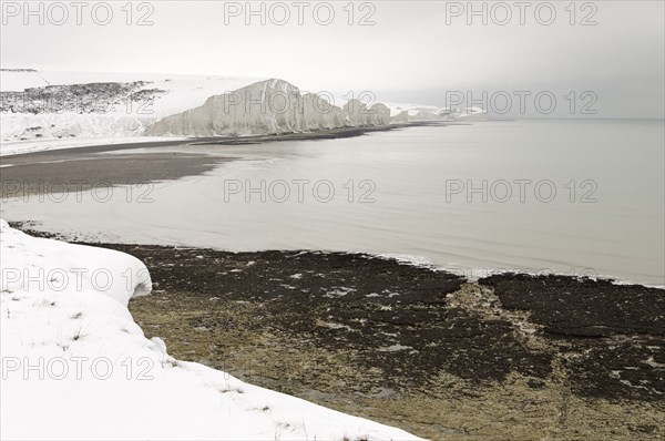 Seven Sisters Snow covered chalk cliffs viewed from the coastguard cottages at Cuckmere Haven.