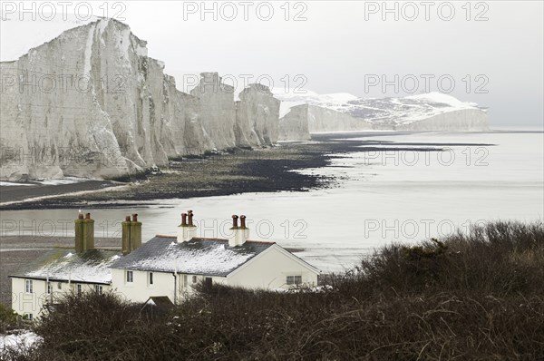 Seven Sisters Snow covered chalk cliffs viewed from the coastguard cottages at Cuckmere Haven.