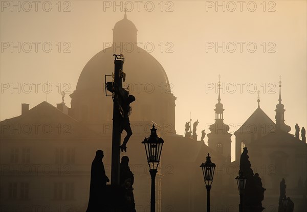 Charles Bridge Calvary in early morning mist.