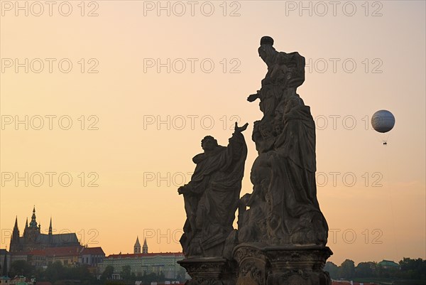 Charles Bridge Statue of the Madonna attending to St. Bernard with St Vitus in distance.