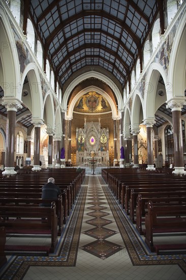 Falls Road Clonard Monastery interior decorated for Good Friday with statues draped in purple cloth.