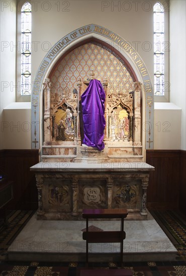 Falls Road Clonard Monastery interior decorated for Good Friday with statues draped in purple cloth.