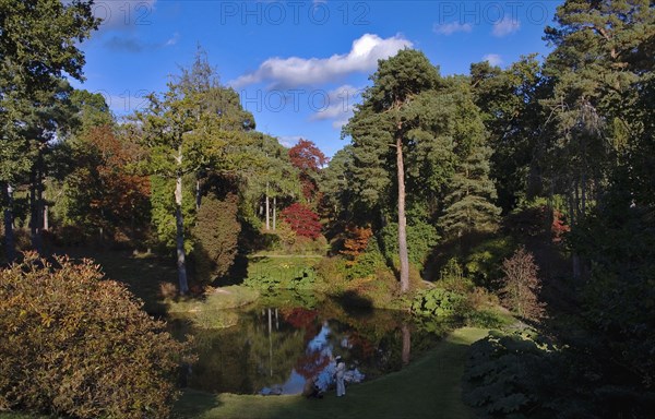 Leonardslee Lakes and Gardens Middle Pond and autumn trees.