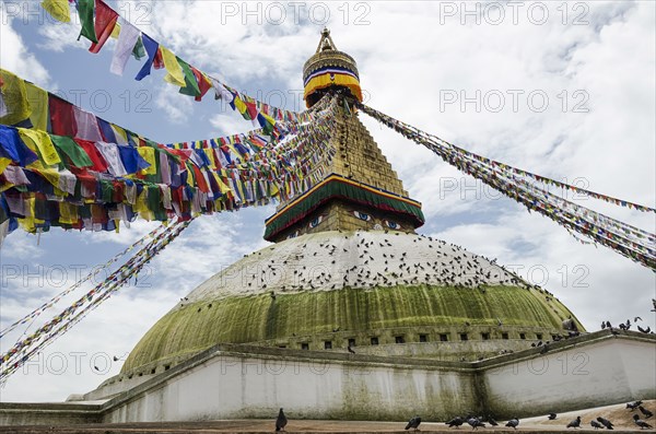 Boudhanath Stupa near Kathmandu, with coloutful prayer flags.