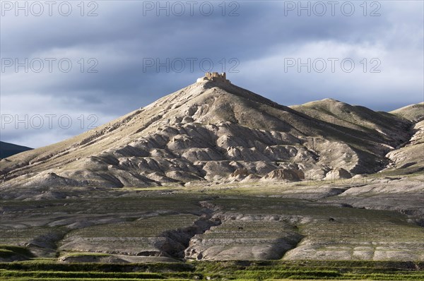 The ruins of the ancient King's Ame Pal fortress Rani's Fort in front of Ketcher Dzong at the top of the mountain.