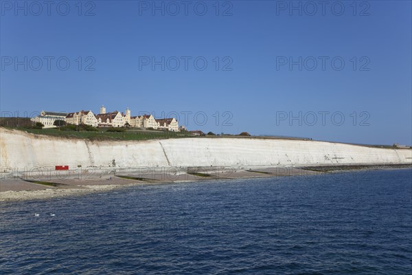 White cliff coastline with Roedean private school for girls.