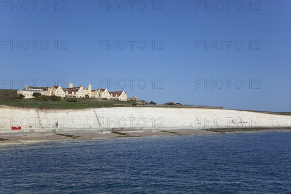 White cliff coastline with Roedean private school for girls.