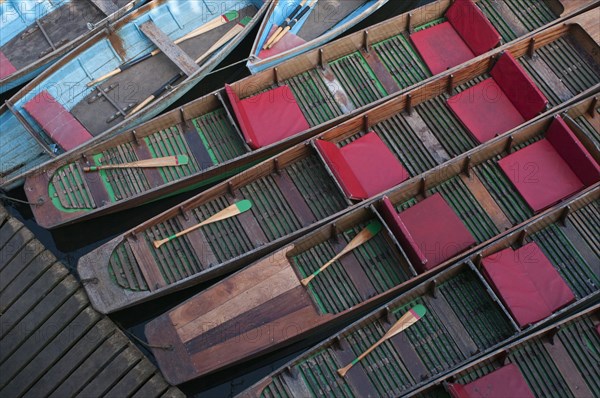 Moored rowing boats on the river Cherwell near Magdalen bridge.