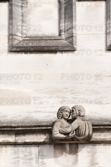 Frieze of Magdalen College Sculptured figure of a man and a woman locked in an embrace.