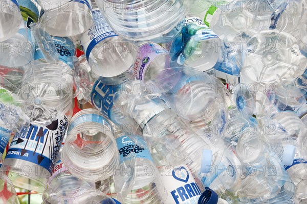 Plastic bottles attached to a wire fence at the WOMAD festival to highlight the need to recycle non-sustaninable materials.