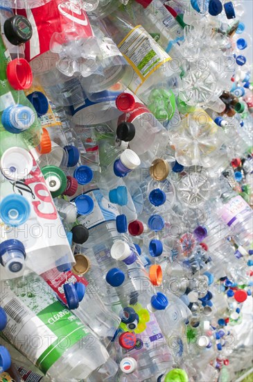 Plastic bottles attached to a wire fence at the WOMAD festival to highlight the need to recycle non-sustaninable materials.