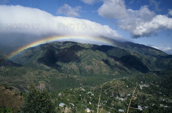 West Indies, Jamaica , Blue Mountains, Mountain landscape with rainbow and drifts of cloud. Photo : Gavin Wickham