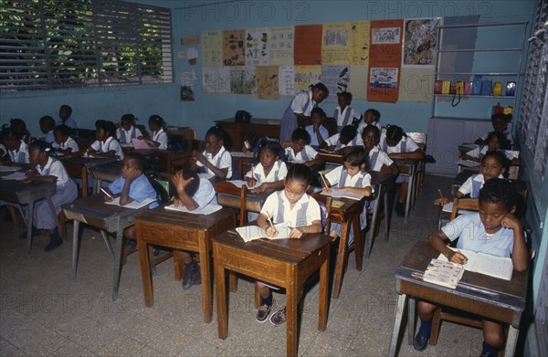 West Indies, Jamaica , Children, Children at desks in school classroom. Photo : David Cumming